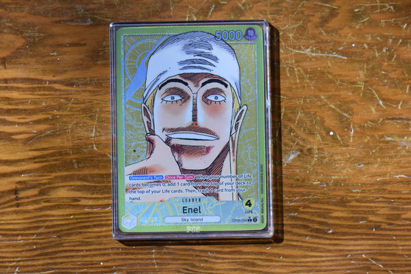 Enel Alternate Art Leader encased in a PCG Slim Player Slab on wooden shelf.