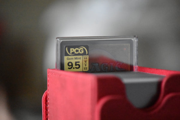 Graha Tia PCG 9.5 Gem Mint in a Slim Player Slab inside a red deckbox - back view