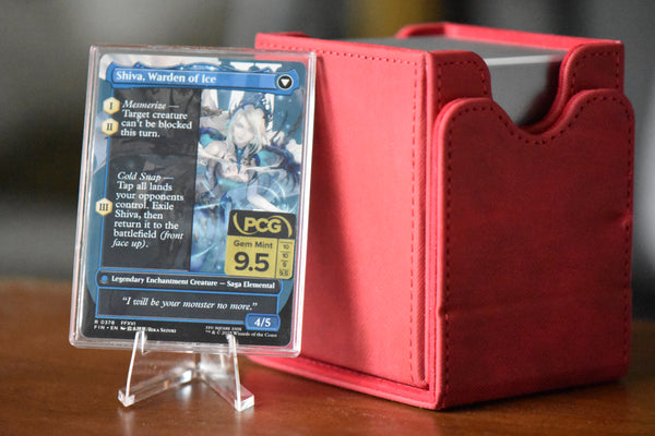 Jill Shiva's Dominant PCG 9.5 Gem Mint in a Slim Player Slab next to red deckbox - back view