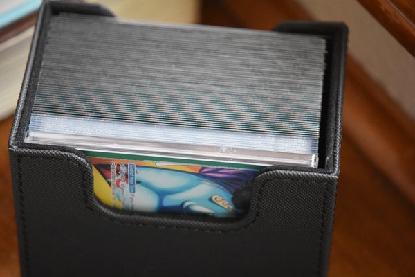 Jinbe Slim Player Slab inside a black Ultimate Guard deckbox along with a One Piece deck and DON!!.