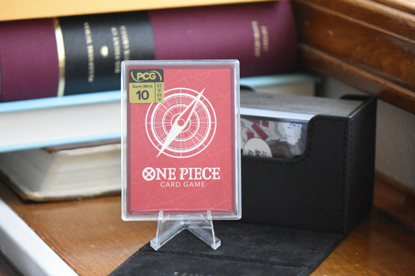 Koby Alt Art PCG 10 in a Slim Player Slab next to a black deckbox - back view.