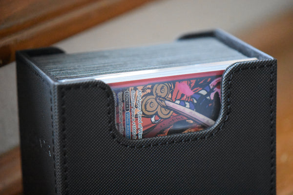 Kouzuki Oden (SP) Slim Player Slab inside of a black Ultimate Guard Sidewinder deckbox.