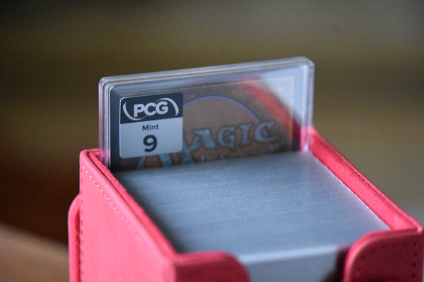 Oloro Judge Promo PCG 9 Mint in a Slim Player Slab inside a red deckbox - back view