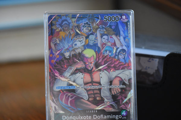 Closeup shot of a Donquixote Doflamingo Alt Art Leader in a PCG Slim Player Slab.