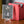 Emet-Selch PCG 9.5 Gem Mint in a Slim Player Slab next to a red deckbox - front