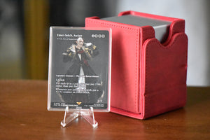 Emet-Selch PCG 9.5 Gem Mint in a Slim Player Slab next to a red deckbox - front