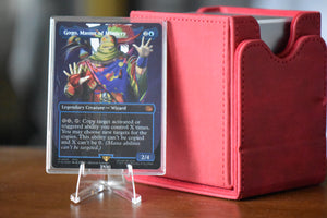 Gogo Surge Foil PCG 9.5 Gem Mint in a Slim Player Slab next to red deckbox - front view