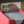 Hero of Light PCG 9.5 Gem Mint in a Slim Player Slab inside red deckbox - back view