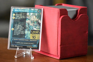Jill Shiva's Dominant PCG 10 Pristine in a Slim Player Slab next to red deckbox - back view