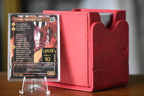 Joshua Phoenix PCG 10 Flawless in a Slim Player Slab next to red deckbox - back view
