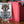 Kozilek Borderless PCG 9 Mint in a Slim Player Slab next to a red deckbox - front view