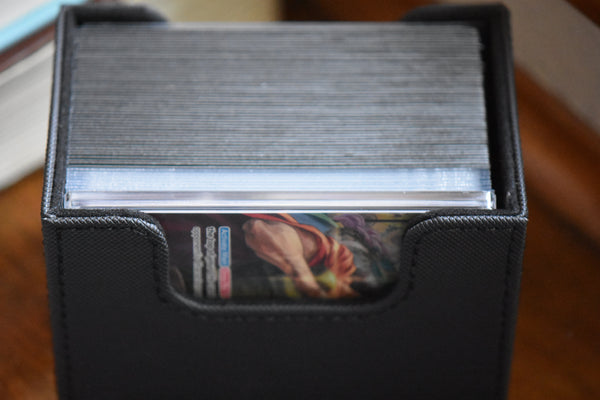 Slim Player Slab featuring Kyros Alt Art Leader inside a black Ultimate Guard deckbox.