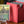Meren Borderless PCG 9 Mint in a Slim Player Slab next to a red deckbox - front view