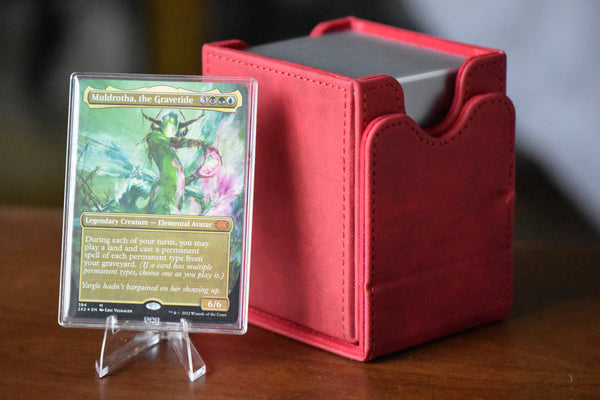Muldrotha Borderless PCG 9 Mint in a Slim Player Slab next to a red deckbox - front view