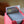 Nekusar Borderless PCG 10 Gem Mint in a Slim Player Slab inside a red deckbox - back view
