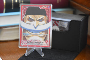 Newgate Alt Art PCG 10 in a Slim Player Slab next to a black deckbox - front view.