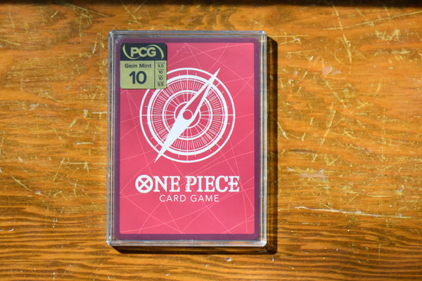 Backside of a One Piece Leader encased in a PCG Slim Player Slab with grade label.