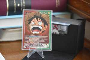 OP13 Luffy Alt Art PCG 10 in a Slim Player Slab in front of a black Sidewinder deckbox.