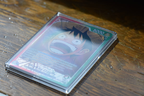 Angled view of an OP13 Luffy Alt Art PCG 10 highlighting the slim slab profile and card texture.