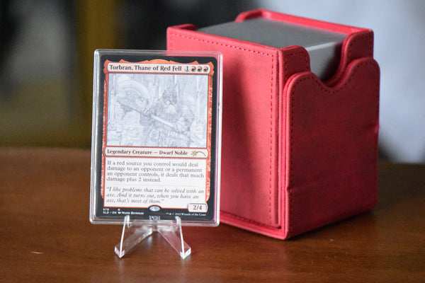 Torbran SLD 678 PCG 9 Mint in a Slim Player Slab next to a deckbox - front view