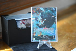 Trafalgar Law Alt Art Leader PCG 9.5 Slim Player Slab next to deckbox - front view