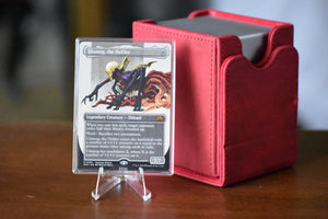 Ulamog Borderless PCG 9 Mint in a Slim Player Slab next to a deckbox - front view